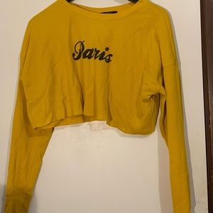 Cropped top that says Paris in cursive, long sleeve